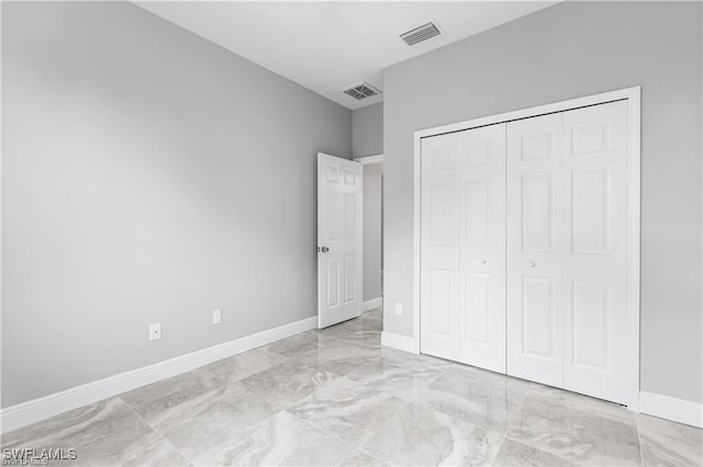 unfurnished bedroom with a closet