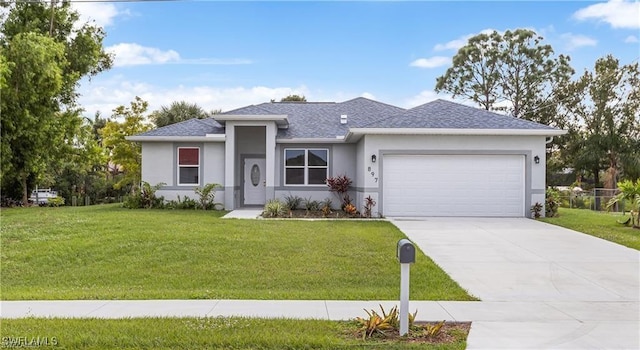 view of front facade featuring a garage and a front lawn