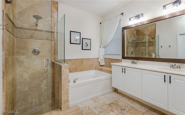 bathroom featuring vanity and shower with separate bathtub