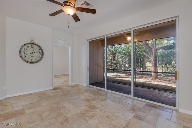 spare room with ceiling fan