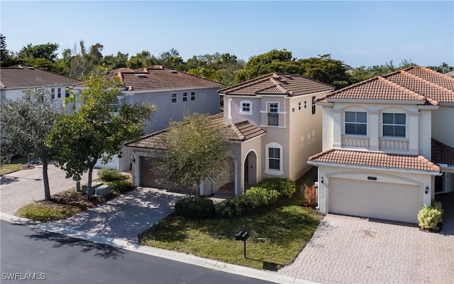 mediterranean / spanish-style house featuring a garage