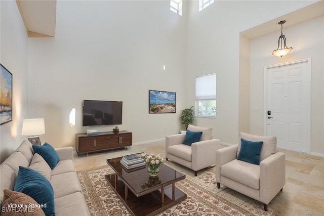 living room with a towering ceiling