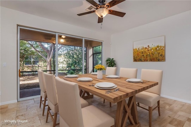 dining room featuring ceiling fan