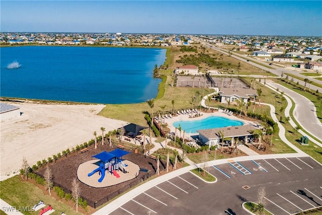 birds eye view of property with a water view