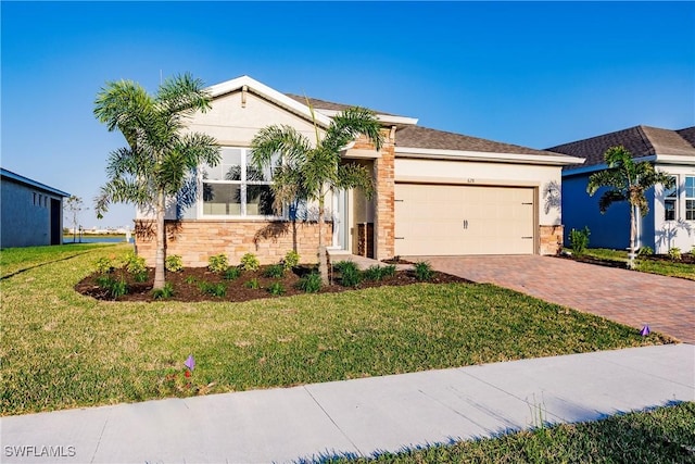 view of front of home with a garage and a front yard