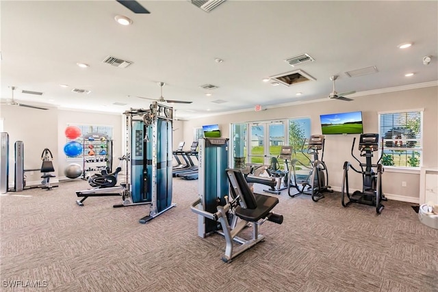 exercise room featuring a wealth of natural light, ceiling fan, and light carpet