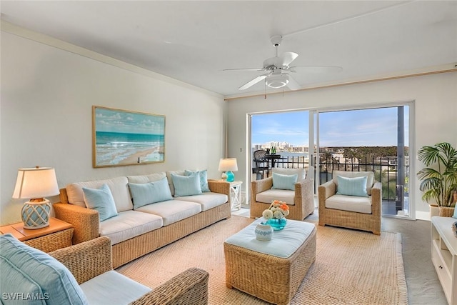 carpeted living room with ceiling fan and ornamental molding