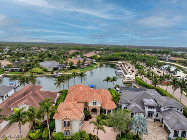 bird's eye view with a water view and a residential view