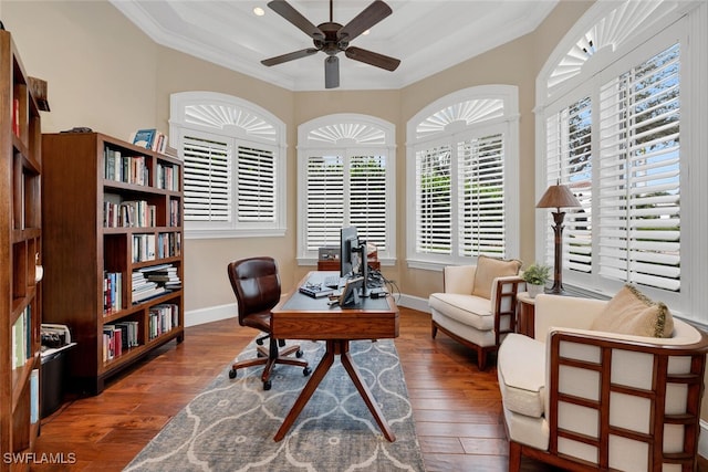 home office with a ceiling fan, baseboards, ornamental molding, and hardwood / wood-style floors