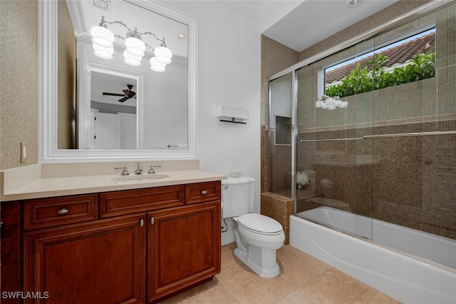 full bathroom with shower / bath combination with glass door, tile patterned flooring, vanity, toilet, and ceiling fan