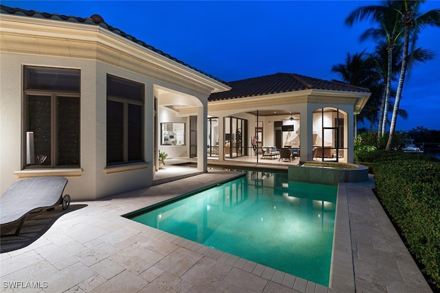 view of pool featuring a patio area and a pool with connected hot tub