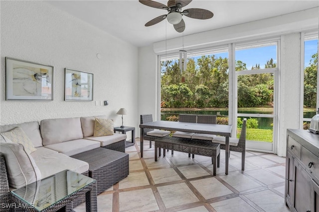 sunroom with ceiling fan and a wealth of natural light