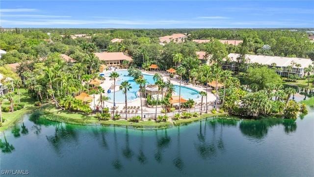 birds eye view of property with a water view