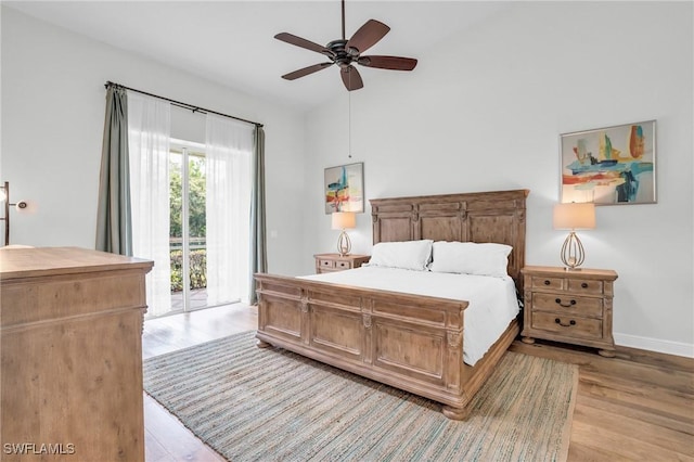 bedroom with access to exterior, ceiling fan, and light wood-type flooring