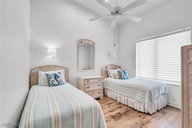 bedroom with ceiling fan and light hardwood / wood-style flooring