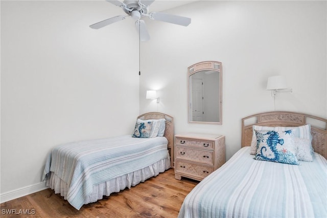 bedroom featuring wood-type flooring and ceiling fan