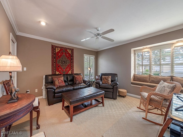 living room with ceiling fan, light colored carpet, and ornamental molding