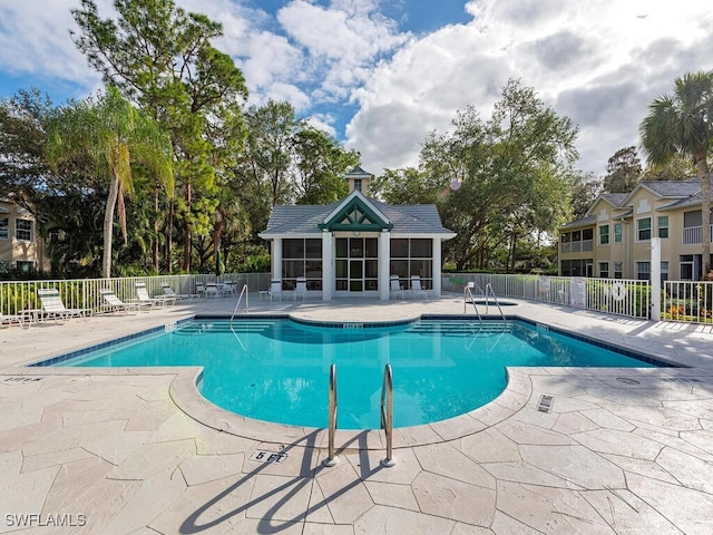 view of swimming pool featuring a patio area