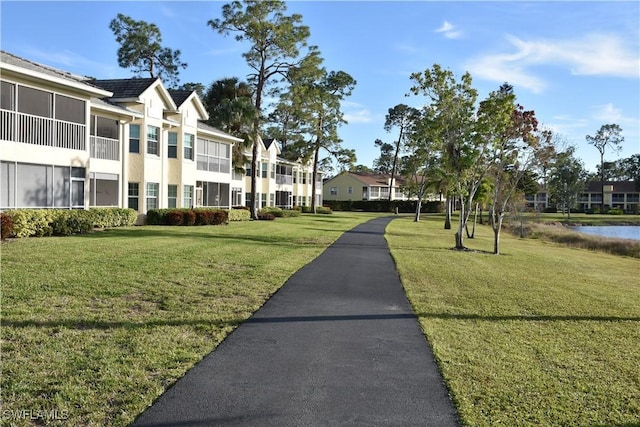 view of home's community with a yard