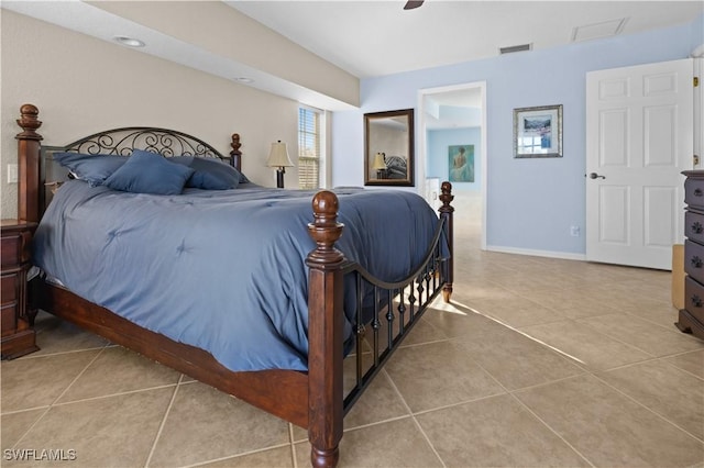 bedroom with ceiling fan and light tile patterned floors