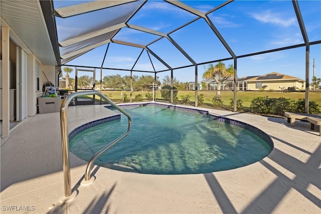 view of swimming pool with glass enclosure and a patio