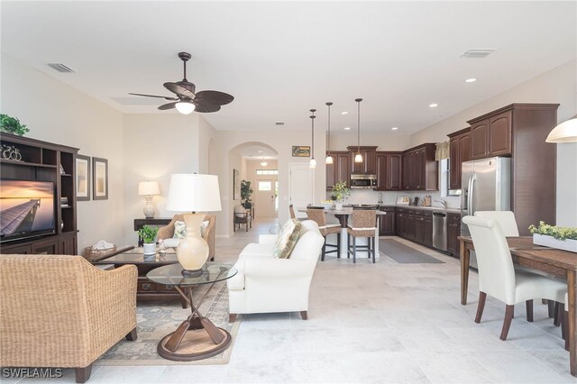 living room featuring ceiling fan