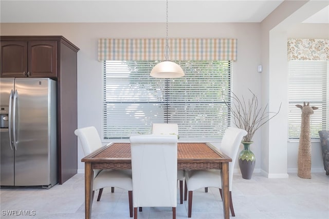 dining area with light tile patterned floors