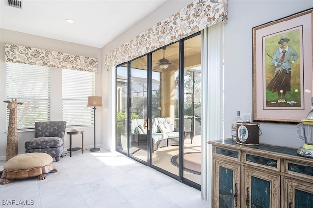 living area featuring recessed lighting, visible vents, and plenty of natural light