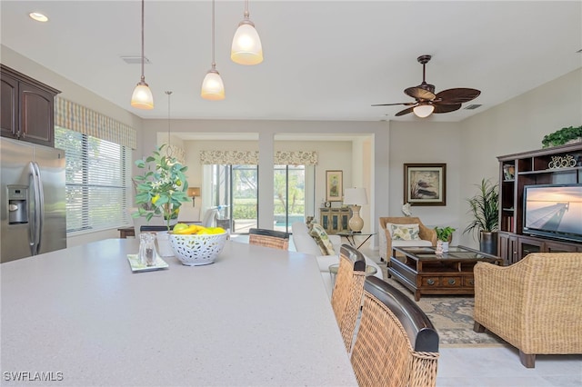 living area featuring recessed lighting, visible vents, and ceiling fan
