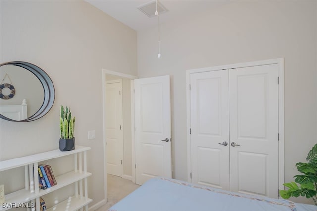 bedroom featuring visible vents and a closet
