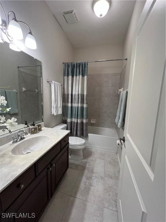 bathroom featuring vanity, visible vents, tile patterned floors, toilet, and shower / tub combo with curtain