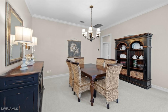 dining room with light carpet, ornamental molding, and a notable chandelier