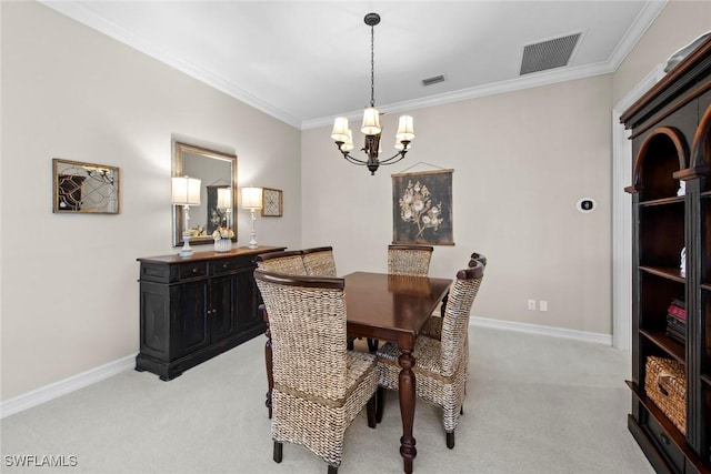 carpeted dining area featuring crown molding and an inviting chandelier