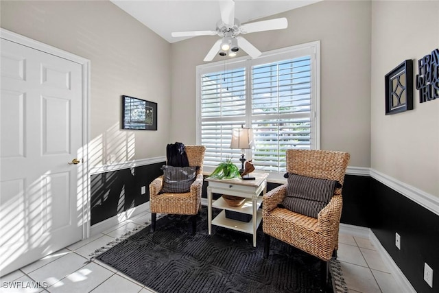 sitting room with ceiling fan and light tile patterned flooring