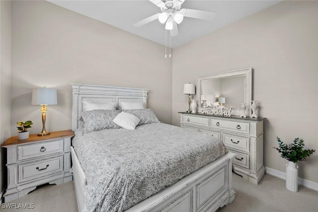 bedroom featuring ceiling fan and light carpet