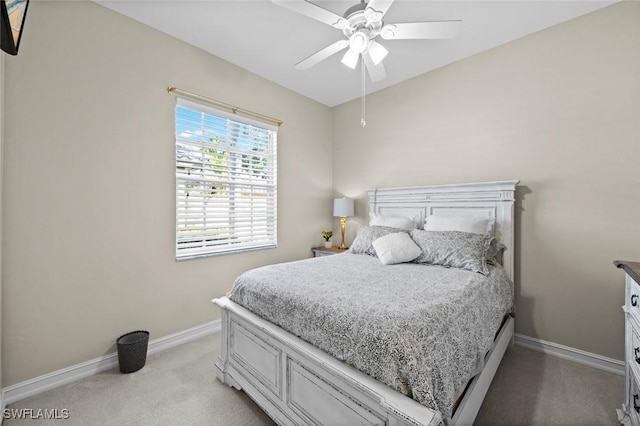 bedroom featuring ceiling fan and light colored carpet