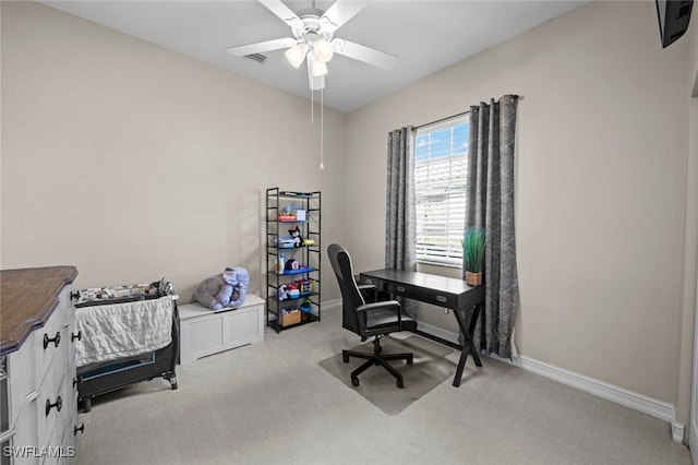 office with light carpet and ceiling fan