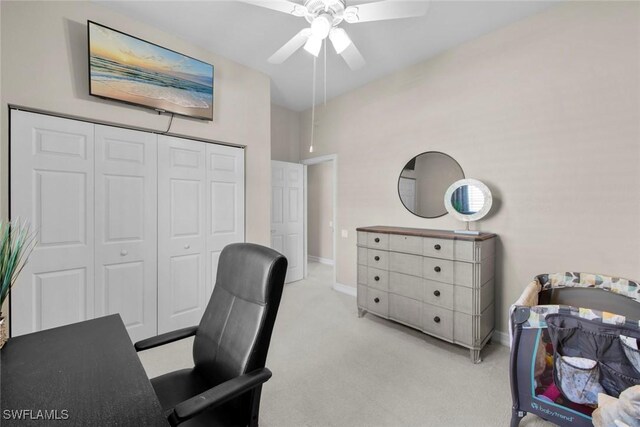 home office featuring ceiling fan and light colored carpet