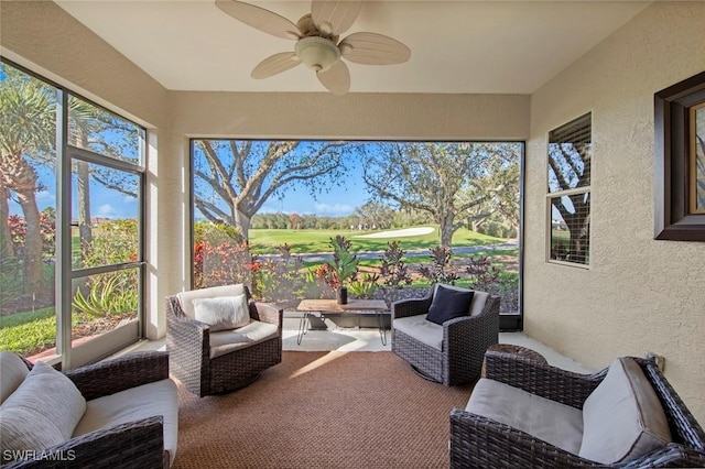 sunroom featuring a wealth of natural light and ceiling fan