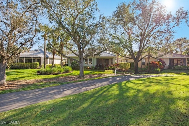 ranch-style home with a front yard