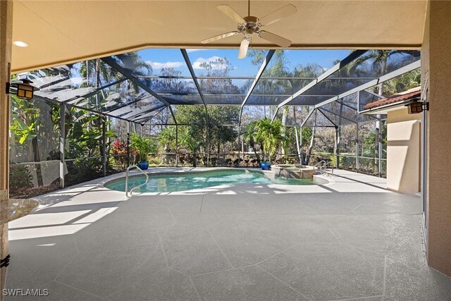 view of swimming pool with an in ground hot tub, a patio, ceiling fan, and a lanai