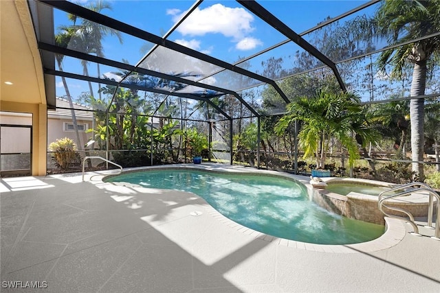 view of pool with a lanai, a patio area, and an in ground hot tub