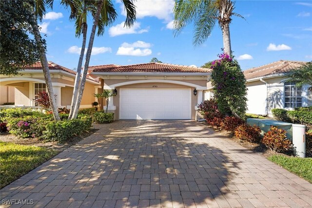 mediterranean / spanish-style home featuring a garage