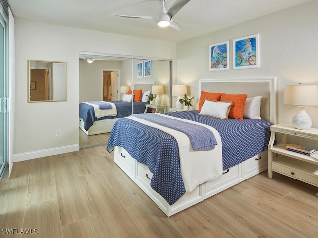 bedroom with ceiling fan, a closet, and light hardwood / wood-style floors