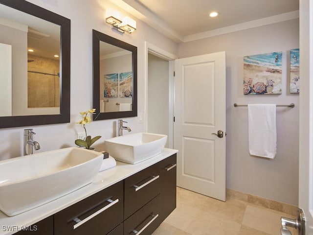 bathroom featuring vanity and ornamental molding