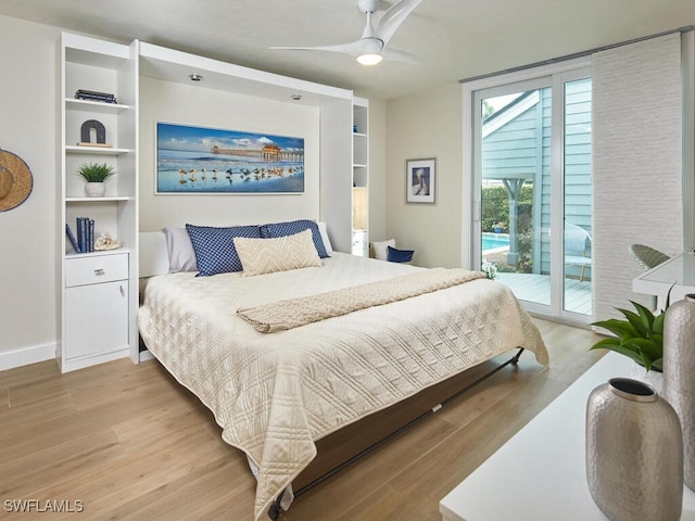 bedroom featuring access to exterior, light hardwood / wood-style floors, and ceiling fan