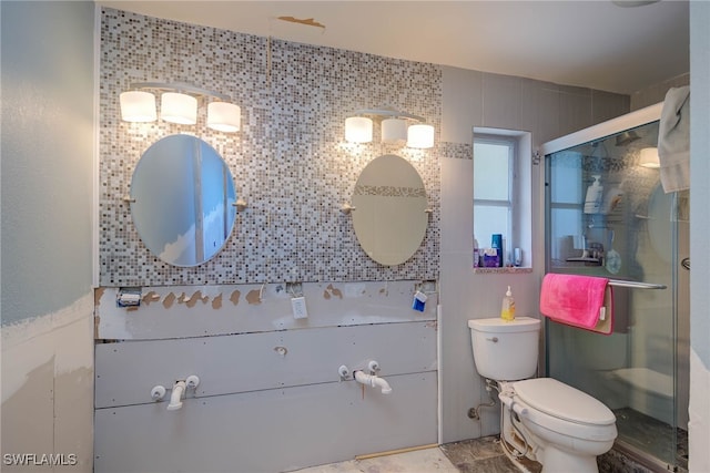 bathroom with walk in shower, tile walls, and toilet