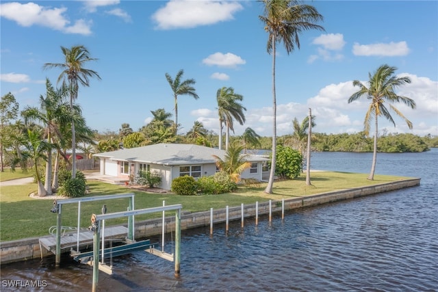 dock area featuring a yard and a water view