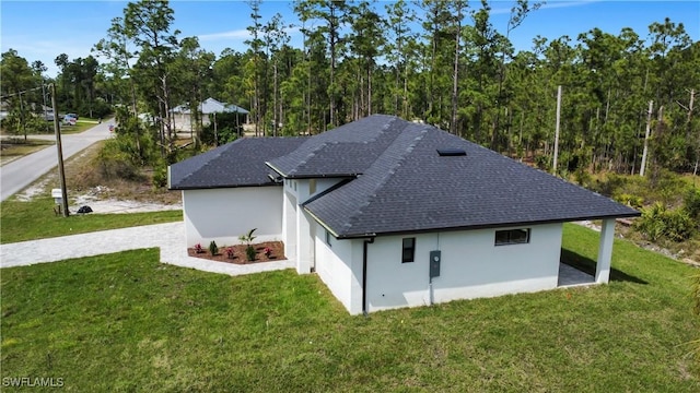 rear view of property with a yard