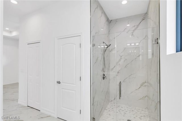 bathroom with a shower with shower door